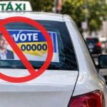 uma imagem com uma ilustração com a proibição de adesivos de candidatos em táxis