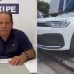 Flávio Fortunato, presidente do Sindtaxi-PE ao lado de um carro